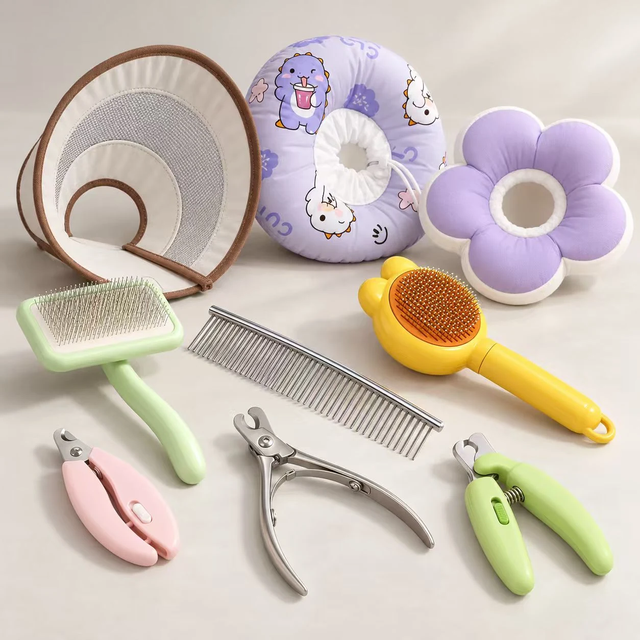 Pet grooming and care products including pet comb styles, manual nail clippers and soft recovery collars.
