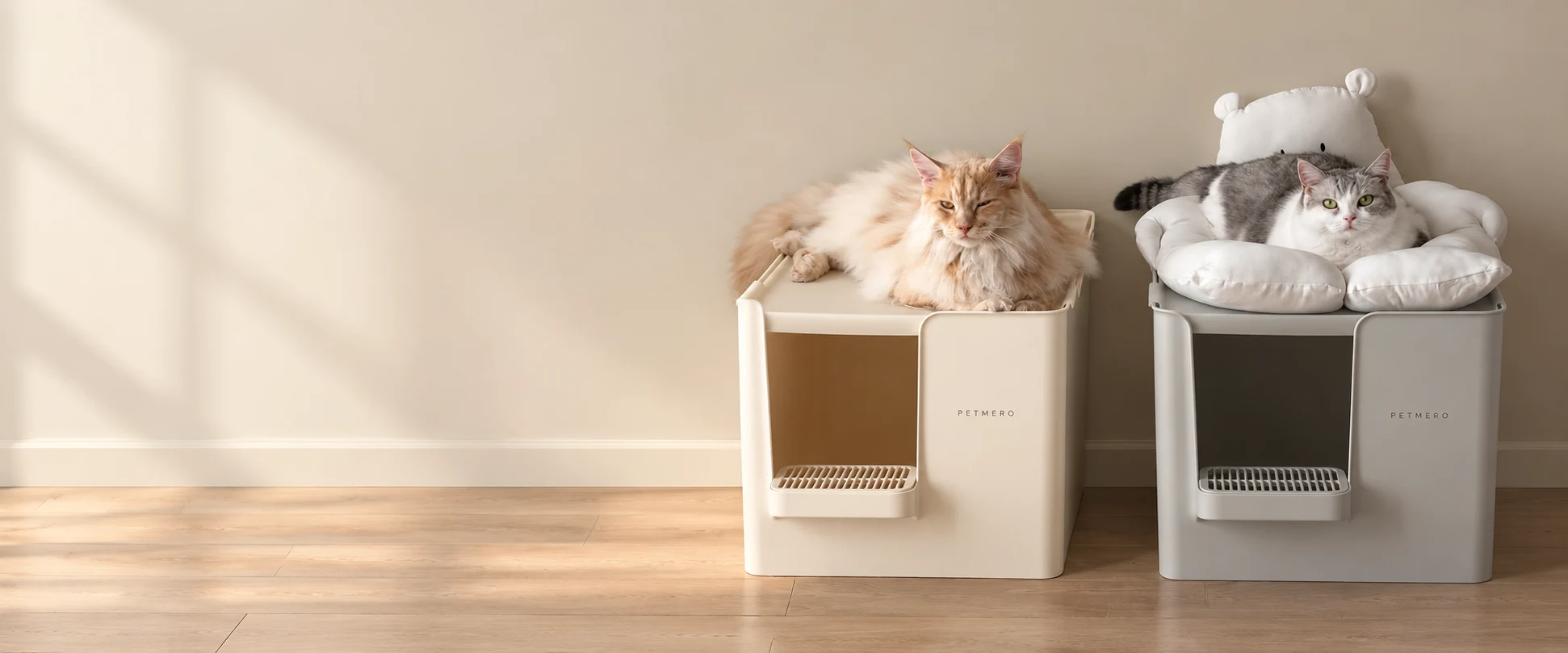 Two cats sitting in separate enclosed cat litter boxes.