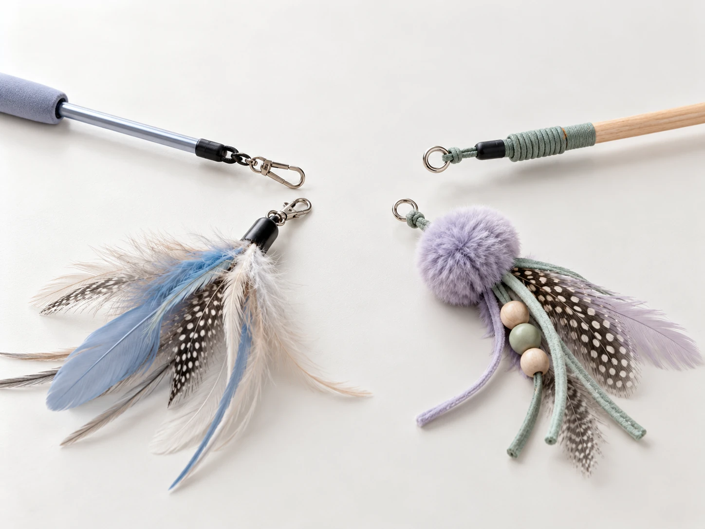 Two cat wand connector types beside feather and pompom replacement attachments.