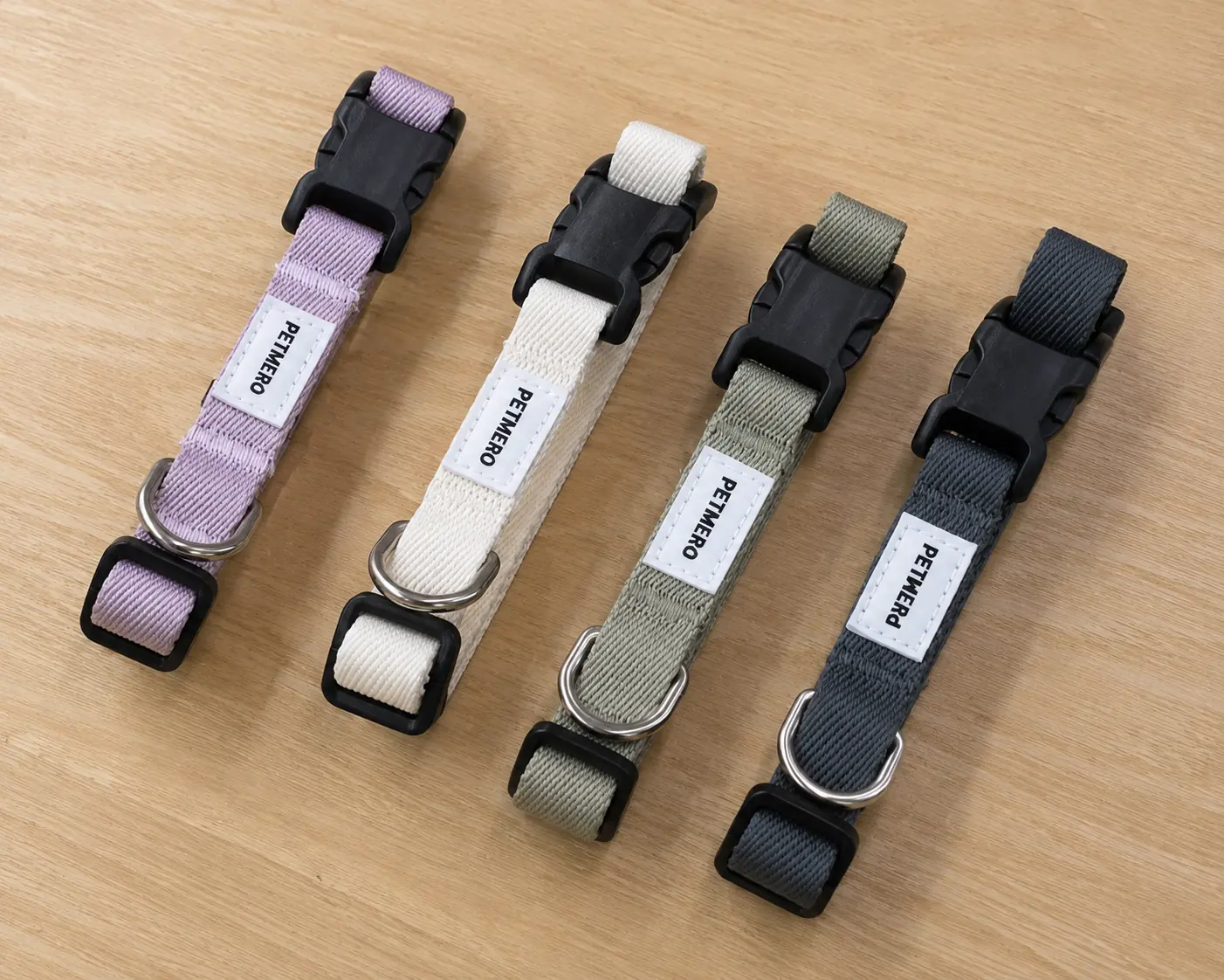 Dog collars in several colours with woven labels and buckles.