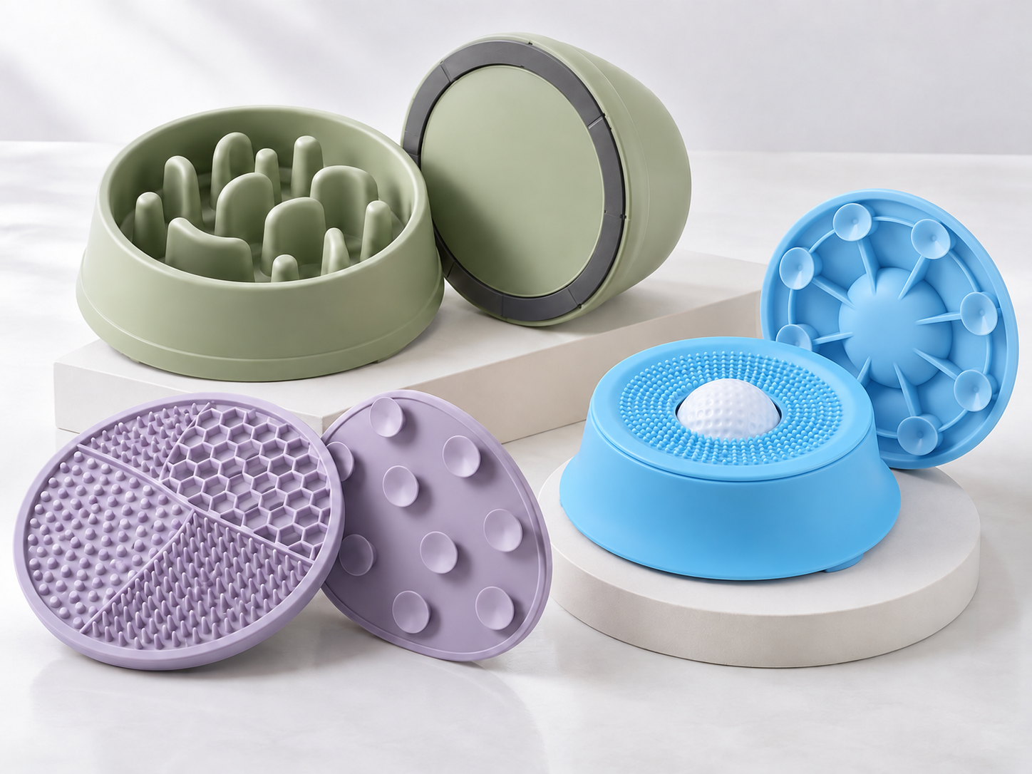 Pet slow feeder bowls and lick mats showing underside rings, suction cups and feeding surfaces.